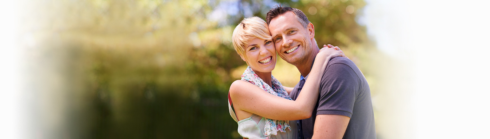 happy couple hugging in a Markham park