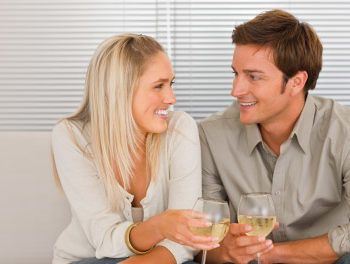 couple sitting really close on the sofa