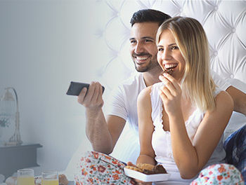 Couple watching TV together