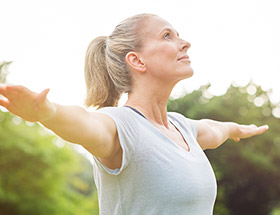 older woman doing yoga