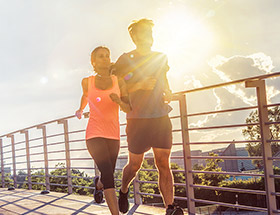 Healthy couple jogging together