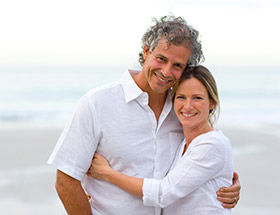 Couple smiling on a beach