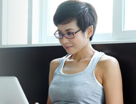 woman writing her online profile