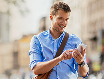 Man using his smartphone to try out a dating app