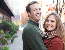 Couple in fall clothing having a hug