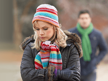 woman wondering whether to take her ex back