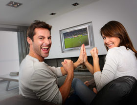 Couple watching rugby