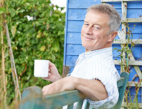 Older single man in his garden