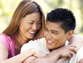 Happy Filipino couple hugging