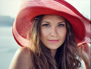 woman with a big red hat