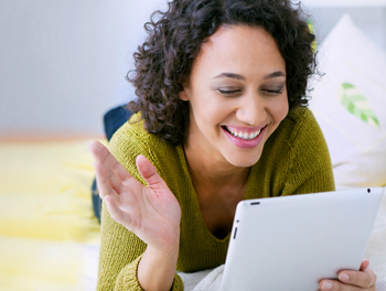 Woman trying different online dating rules on her tablet