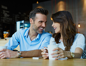 Couple of Professionals on a date in a cafe