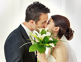 Couple kissing on their wedding day