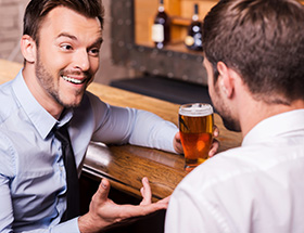 Two men on a date in a bar