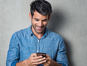 Man with a dating service on his smartphone
