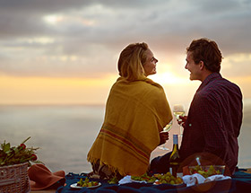 Couple on a picnic at sunset