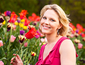 Beautiful woman in a tulip garden