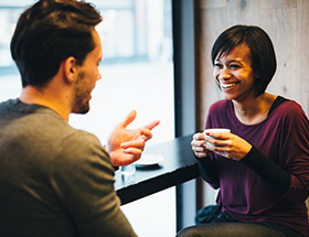 Couple having a coffee together