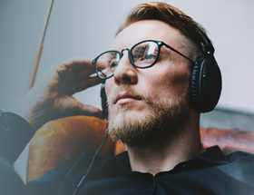 Man listening to a relationship podcast