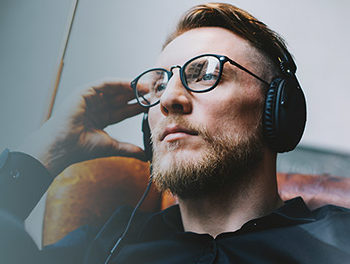 Man listening to a relationship podcast