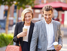 Handsome couple getting coffee together before work