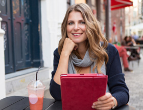 beautiful woman using dating app on her tablet