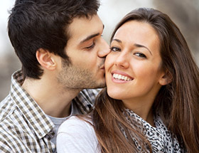Italian couple kissing on the cheek