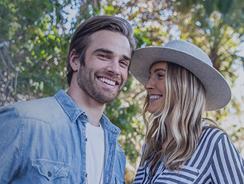 pretty couple smiling outside