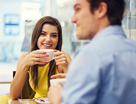 Couple enjoying a coffee together in a cafe