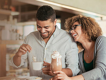 couple in a cafe having fun