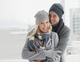 Cuddly couple in warm clothes